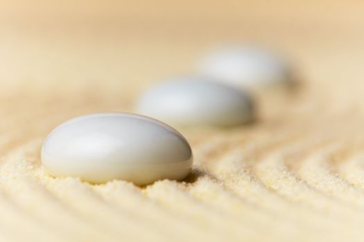 Abstract composition - glass drops on sand surface
