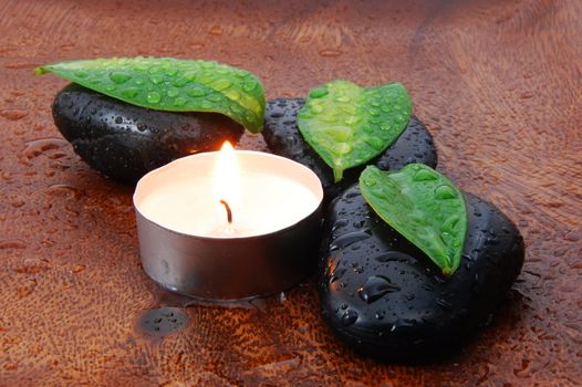 zen stones and leaves showing a wellness or bath concept