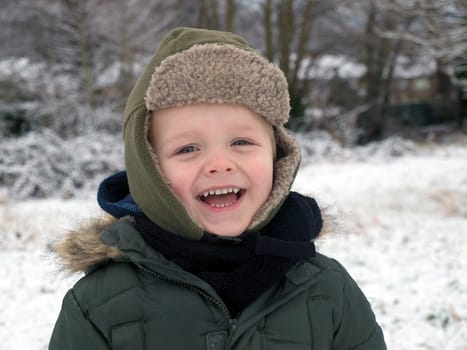 laughing boy in winter day