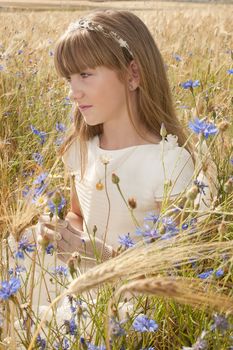 communion dress girl in the field