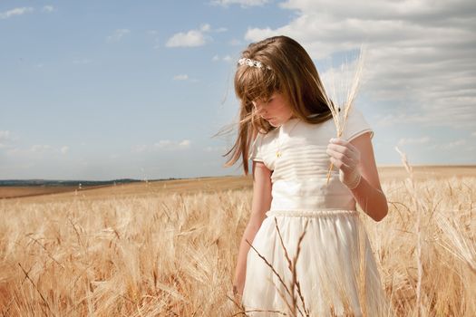 communion dress girl in the field