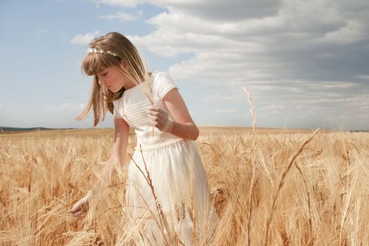 communion dress girl in the field