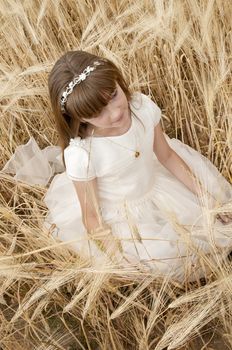 communion dress girl in the field