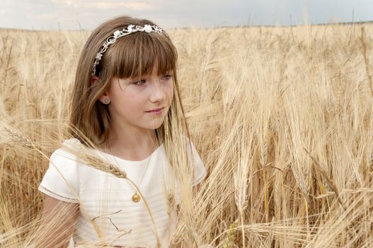 communion dress girl in the field