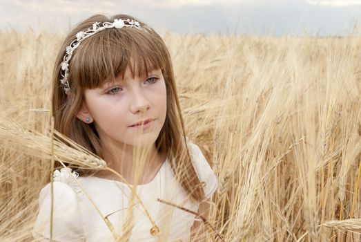 communion dress girl in the field