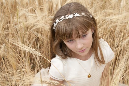 communion dress girl in the field