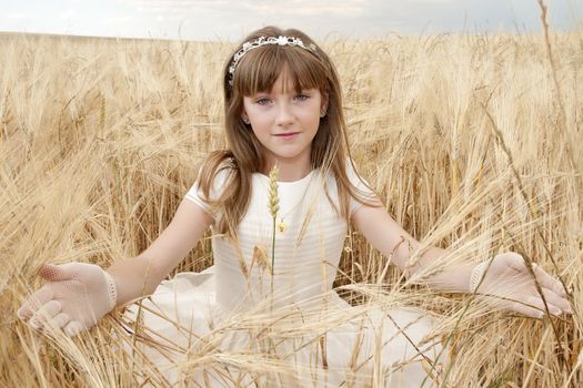 communion dress girl in the field