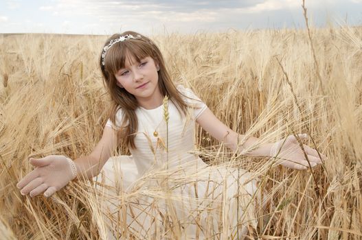 communion dress girl in the field