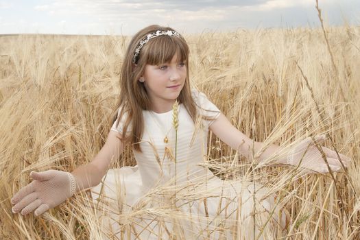 communion dress girl in the field