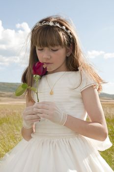 communion dress girl in the field