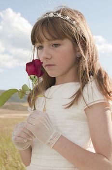 communion dress girl in the field