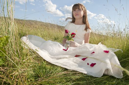 communion dress girl in the field