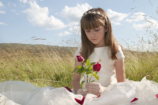 communion dress girl in the field