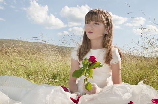 communion dress girl in the field