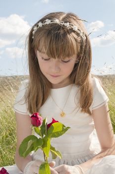 communion dress girl in the field