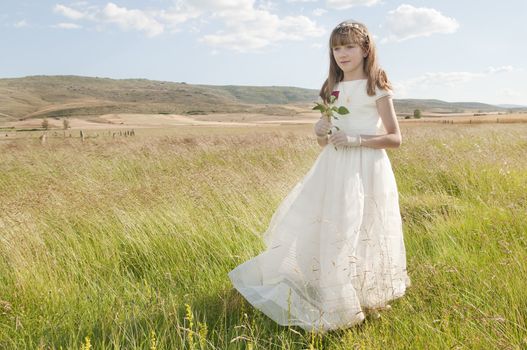 communion dress girl in the field