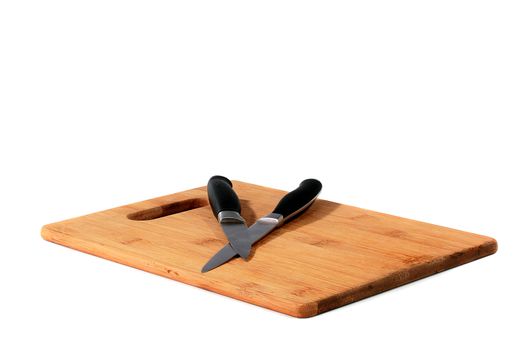 Set from two knifes on bamboo boards for food cutting.