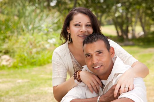 Attractive Hispanic Couple Portrait in the Park.