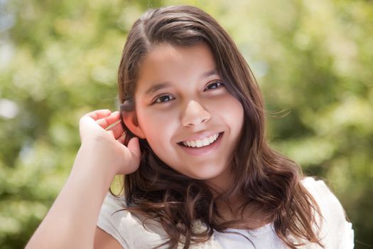 Cute Happy Hispanic Girl Portrait in the Park.