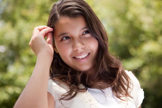 Cute Happy Hispanic Girl Portrait in the Park.