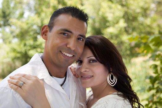 Attractive Hispanic Couple Portrait in the Park.