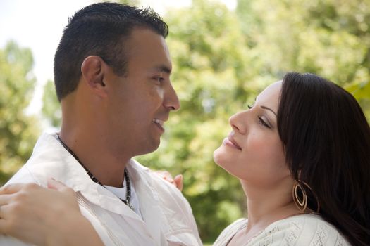 Attractive Hispanic Couple Portrait in the Park.