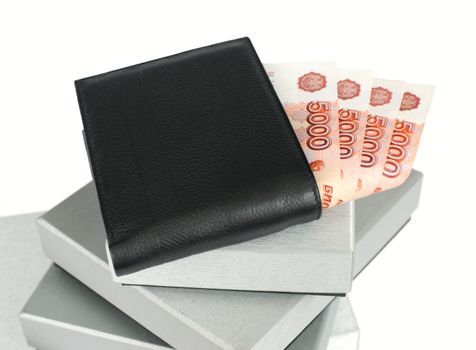 Wallet with Russian banknotes on silver gift boxes