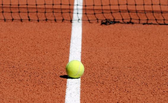 Tennis ball on a tennis court
