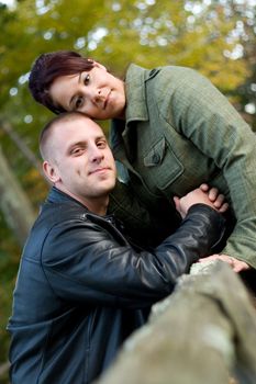 A young happy couple outdoors in a rural country setting.