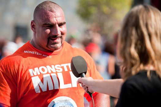 CANARY ISLANDS - SEPTEMBER 03: Ervin Katona from Serbia, with highest score, being interviewed during Strongman Champions League in Las Palmas September 03, 2011 in Canary Islands, Spain