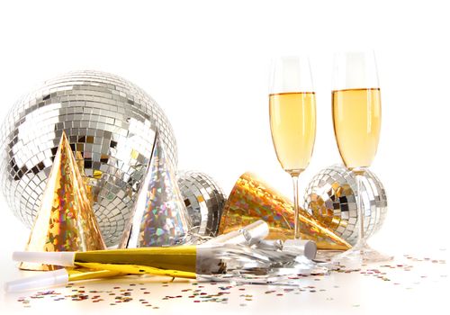 Champagne glasses with gold party hats and big disco ball