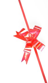 close up of red ribbon on white background on white background