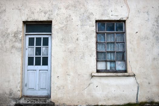 an old decaying house front door and window in ireland