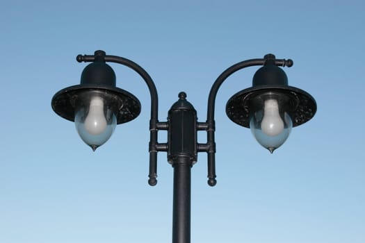 irish street light isolated on blue sky background with clipping path
