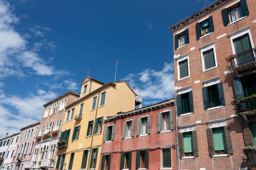 A view of a street with houses typically Venetian