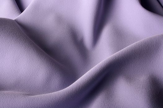 The fabric of lilac colour is used as a background.