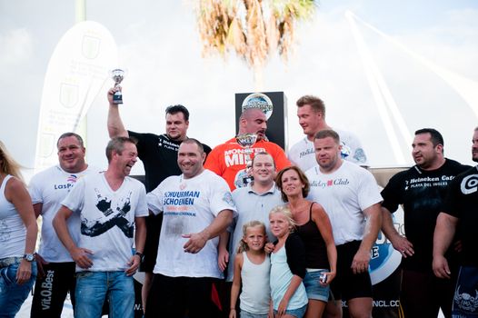 CANARY ISLANDS-SEPTEMBER 03: The winners (from back) Warrick Brant (l) Ervin Katona (m) and Tomi Lotta (r) during Strongman Champions League in Las Palmas September 03, 2011 in Canary Islands, Spain