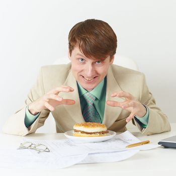 The happy person is going to eat on a workplace