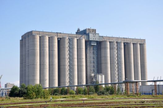 Port granary on a background of the blue sky