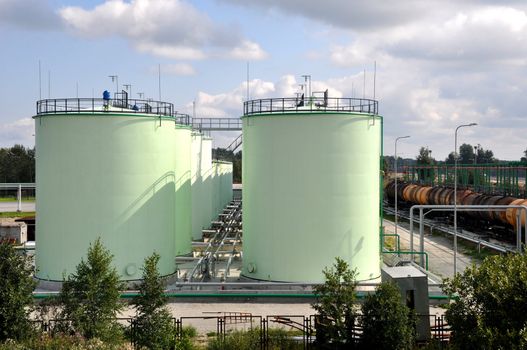 Greater green fuel tanks on a background of sky