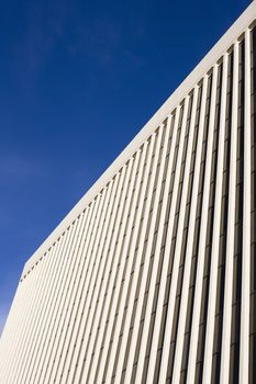 Top Angle of a Large Skyscraper With a Bright Blue Sky