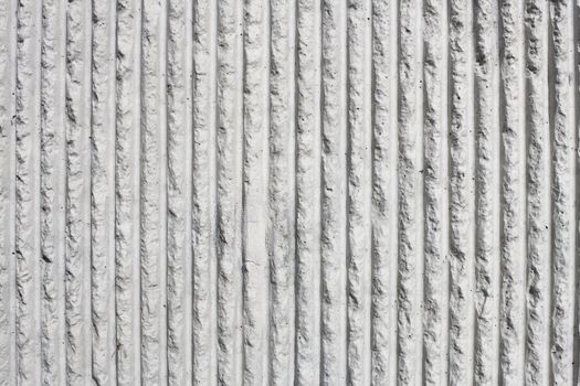 Closeup Detail of a Gray Concrete Wall With a Stripe Pattern