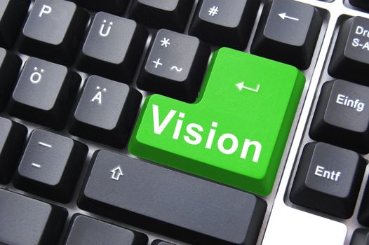 business vision concept with colored key on computer keyboard