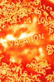 vacation or holiday concept with red pasta snack