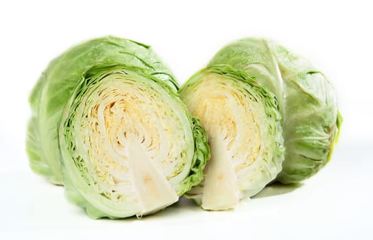 Two sides of sliced green cabbage head