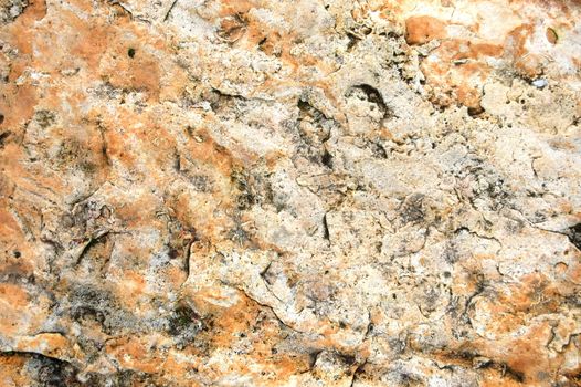 texture of a sandstone rock with reddish surface