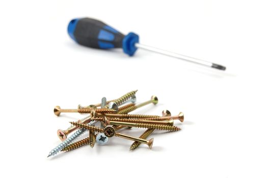 screwdriver and some screws isolated on white background