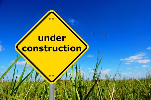 under construction sign and copyspace for a text message