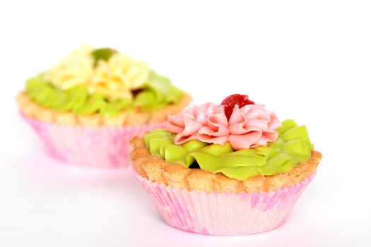 Two small colored tarts isolated on white background