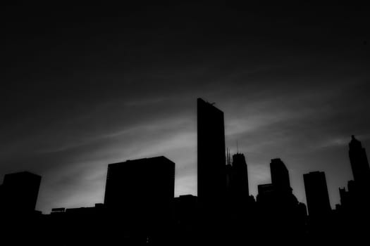 dark silhouette of tall buildings in downtown chicago, illinois